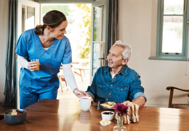 senior at his home with sci homecare caregiver